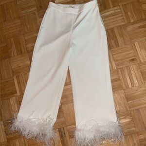 White slacks with feather hem.